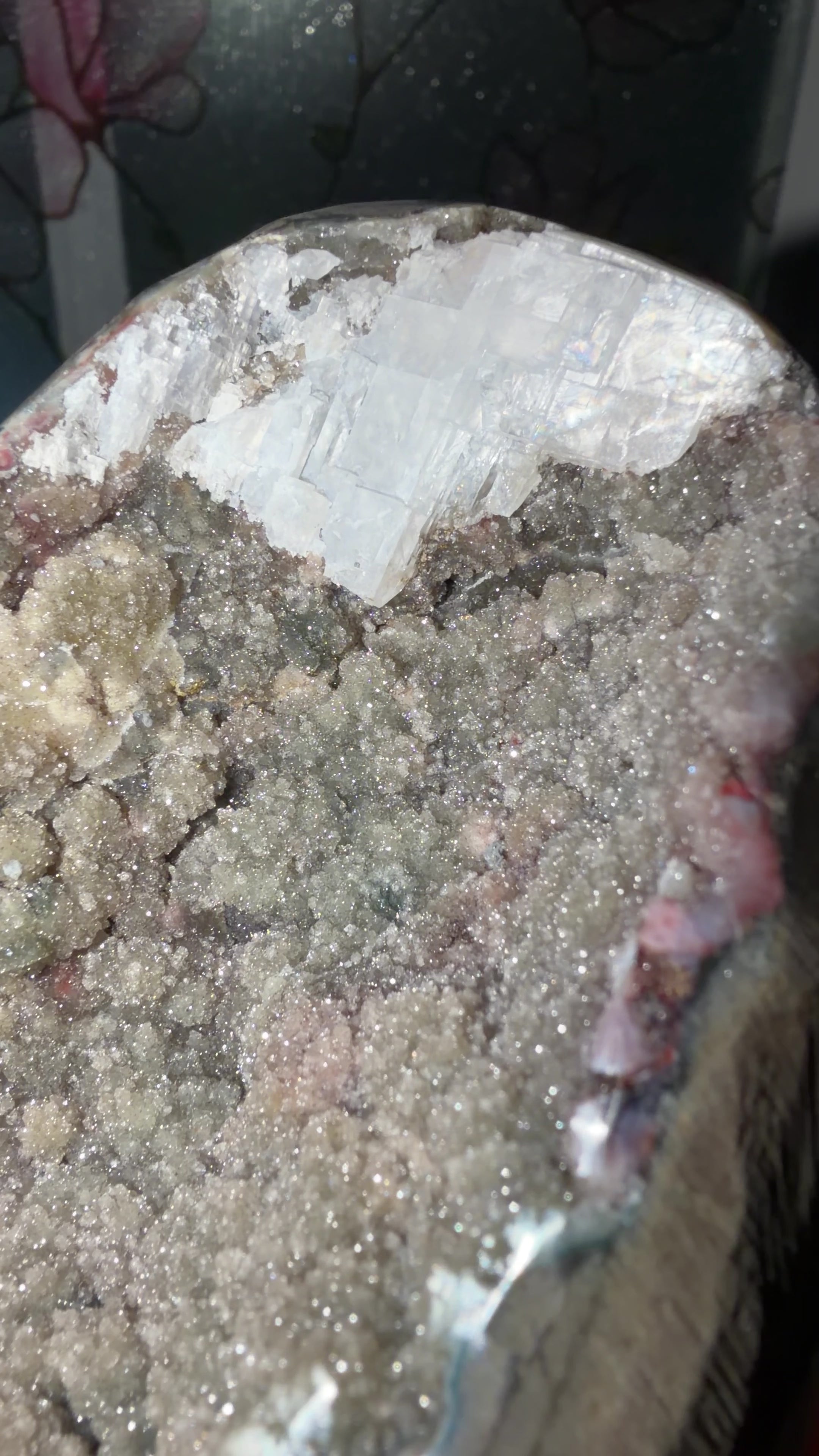 Close up highlighting the purple amethyst points and green druzy quartz with calcite. Sugary brown and white quartz passageway in the middle
5” x 5” x 3.5”