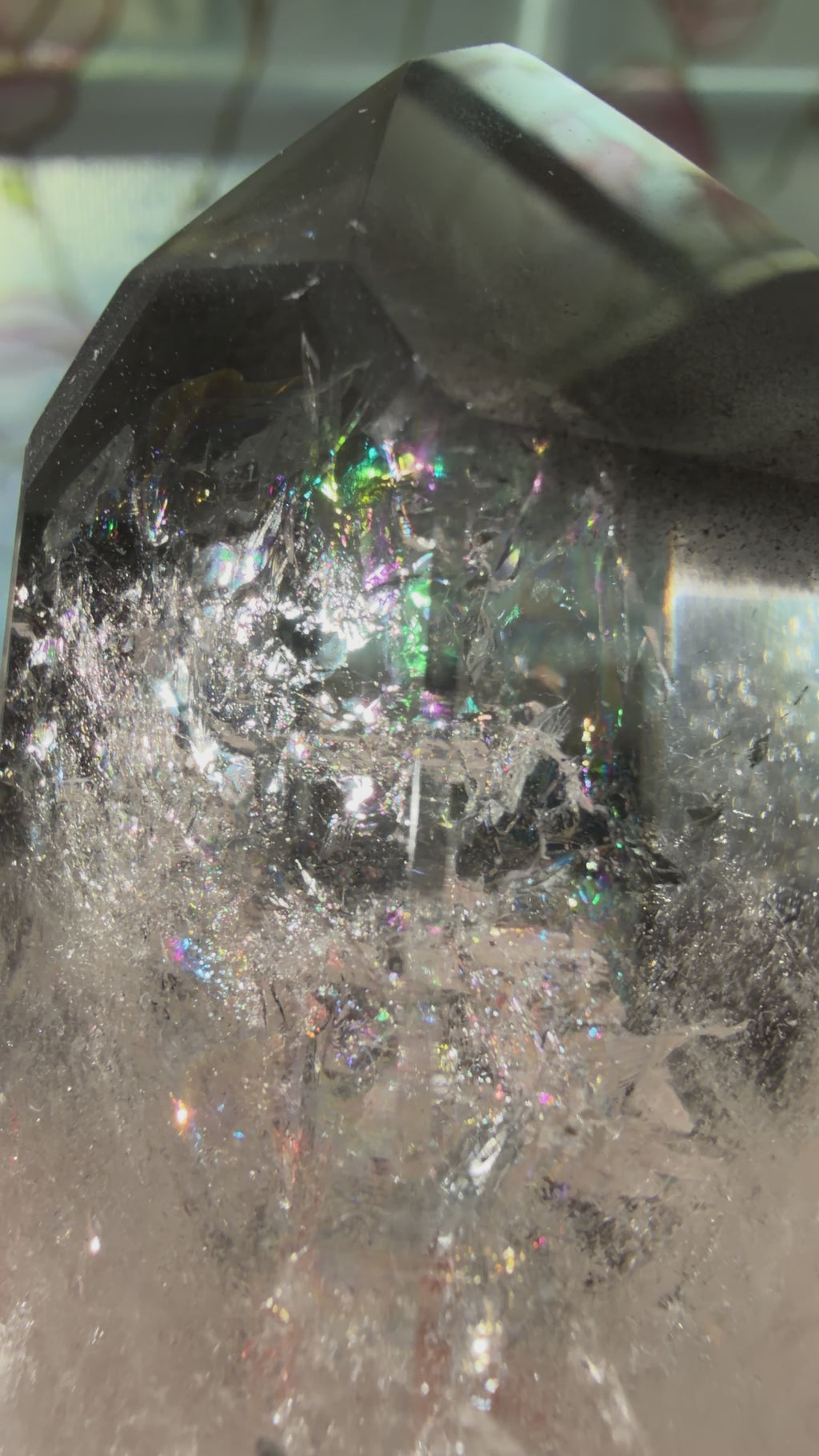 Close up video highlighting internal rainbows and black lithium inclusions. 