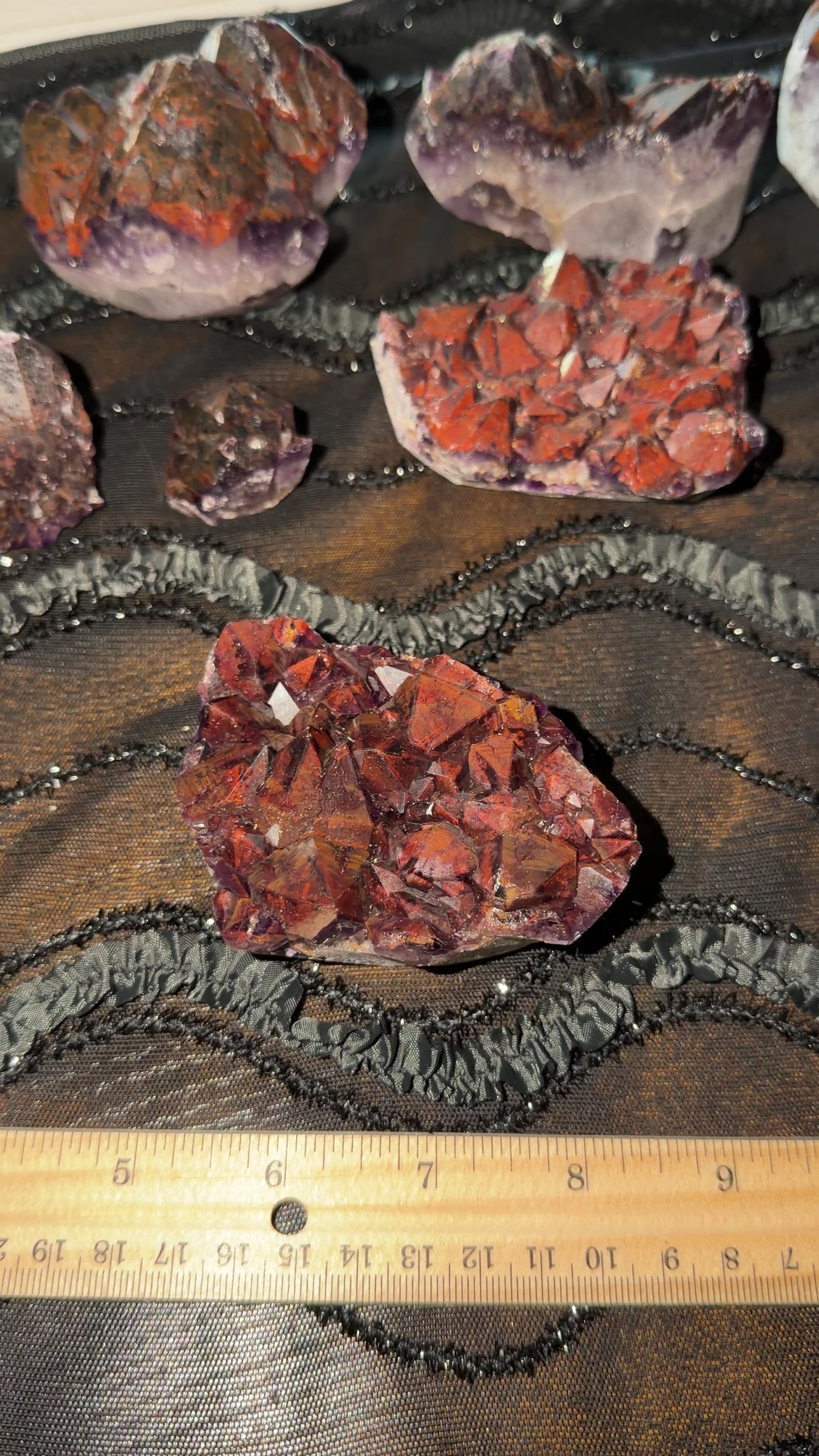 Dark red hematite included purple amethyst point cluster. Palm sized cluster. 
Dimensions are 
3.25” x 1.5” x 2.5”