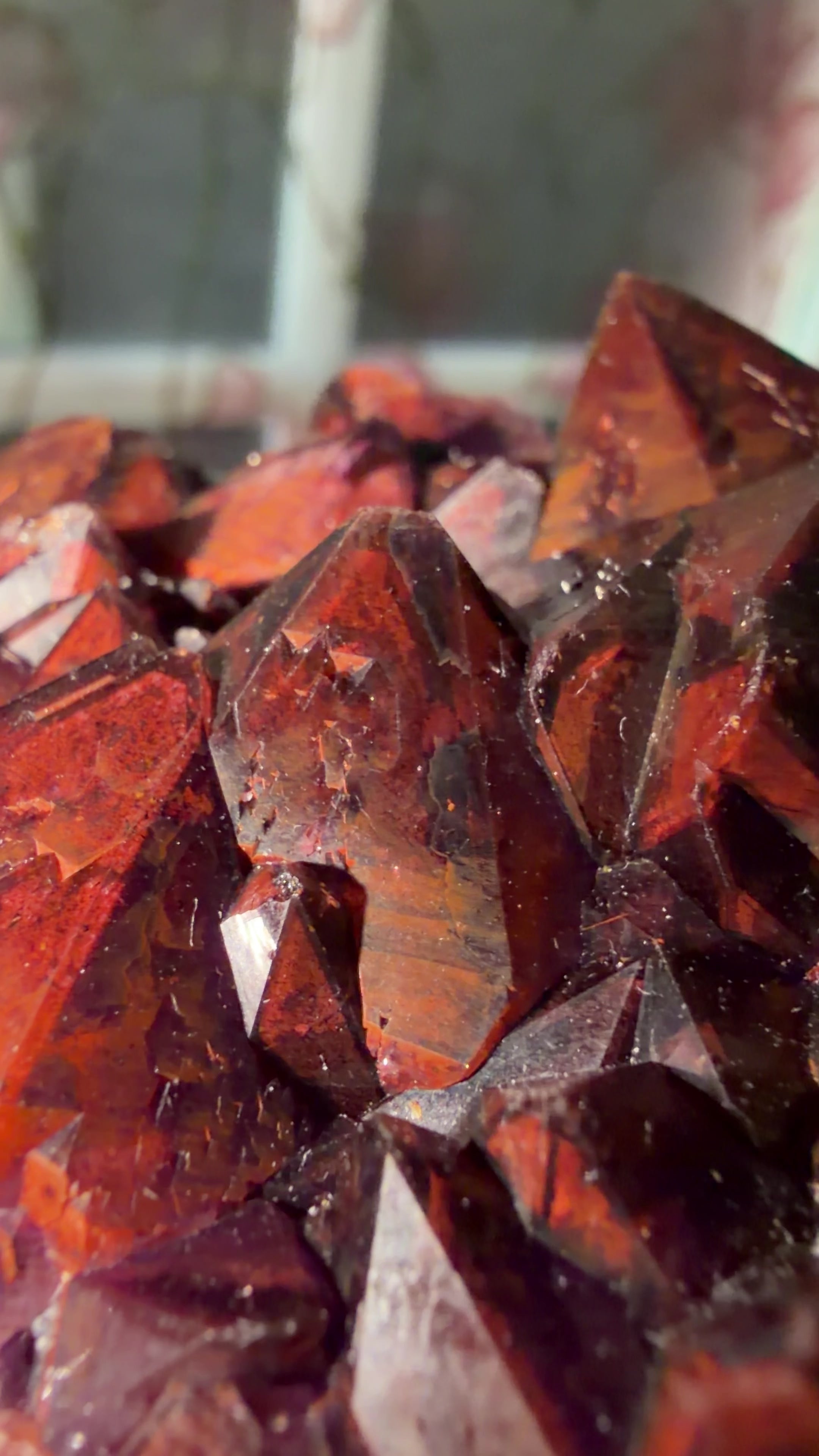 Close up of the dark red hematite included purple amethyst points. 