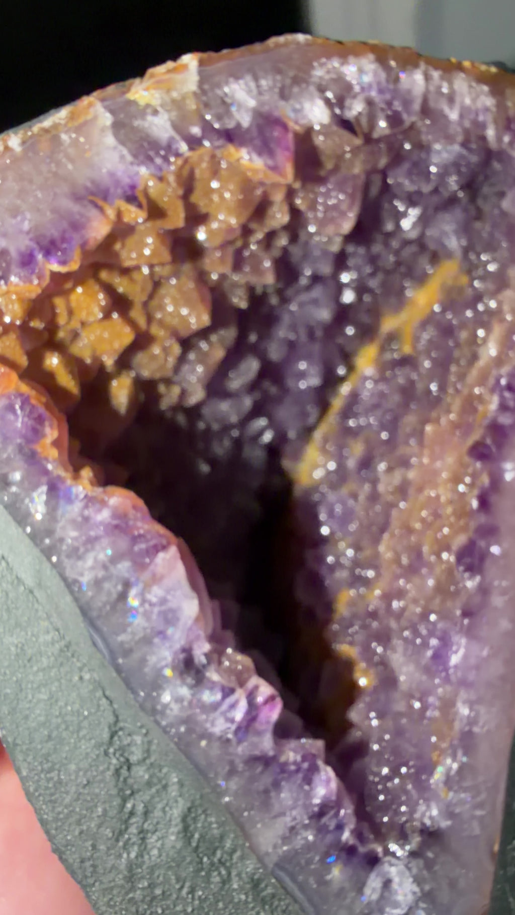 Closeup detailing the microcrystalline quartz coating the purple amethyst points.