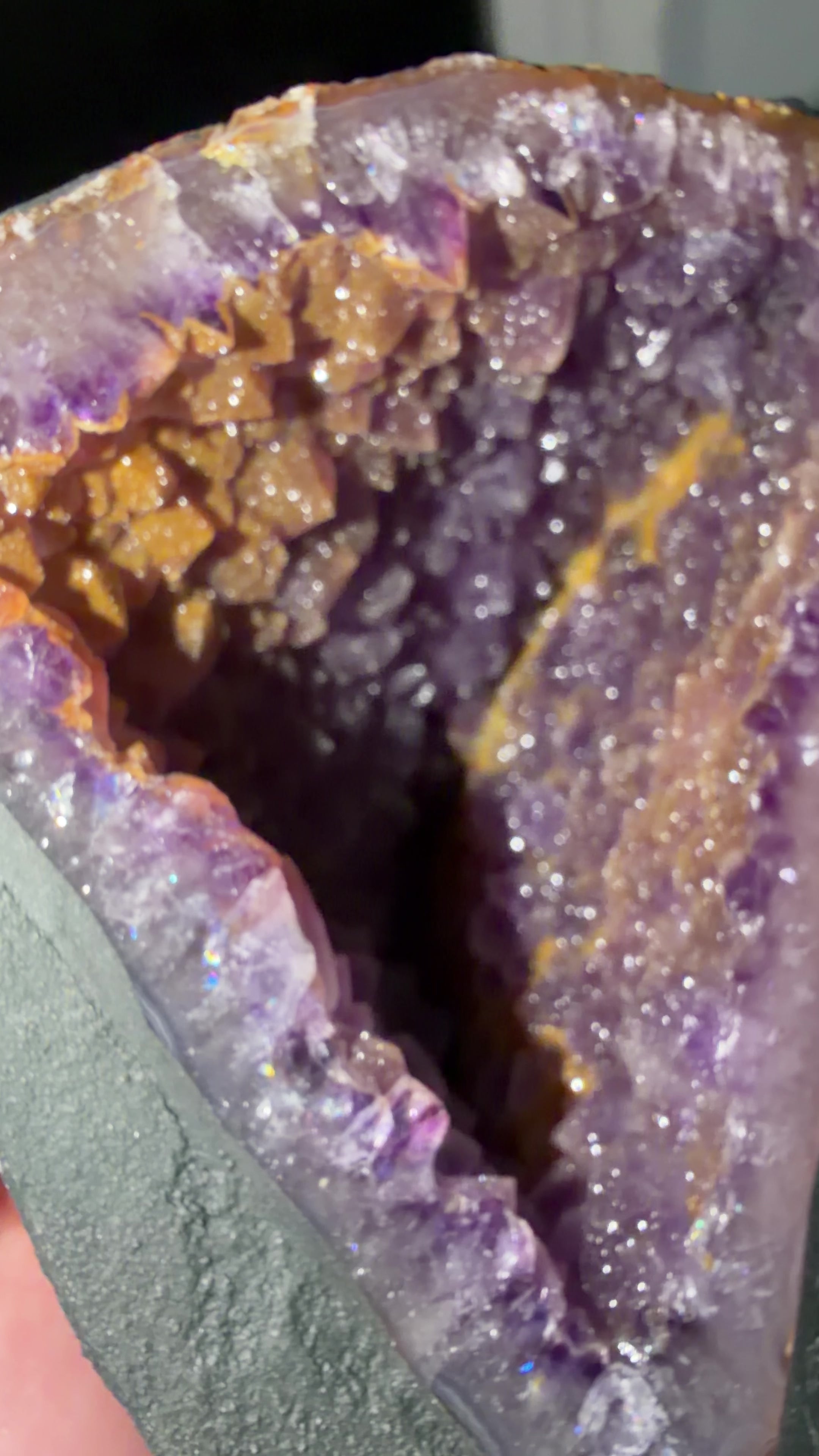 Closeup detailing the microcrystalline quartz coating the purple amethyst points.