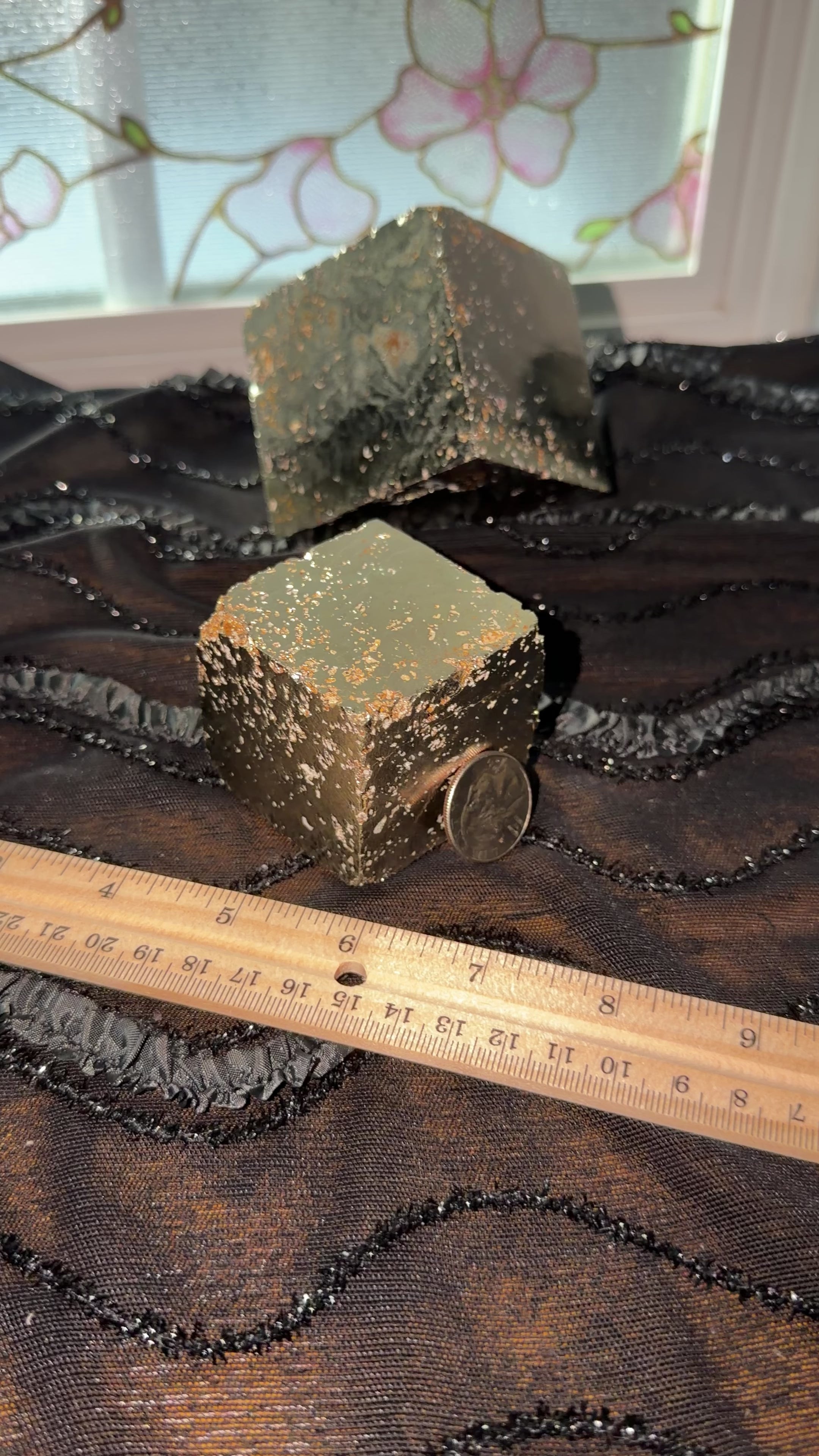 Bronze pyrite cube displayed next to ruler for size reference. Then held in hand and shown a 360 view.