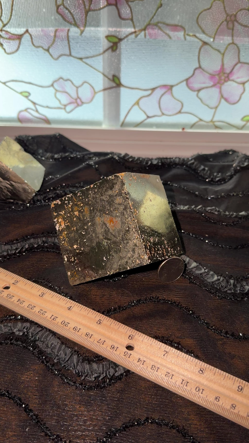 Extra large gold/bronze pyrite cube displayed next to ruler for size reference. Then held in hand and shown a 360 view.