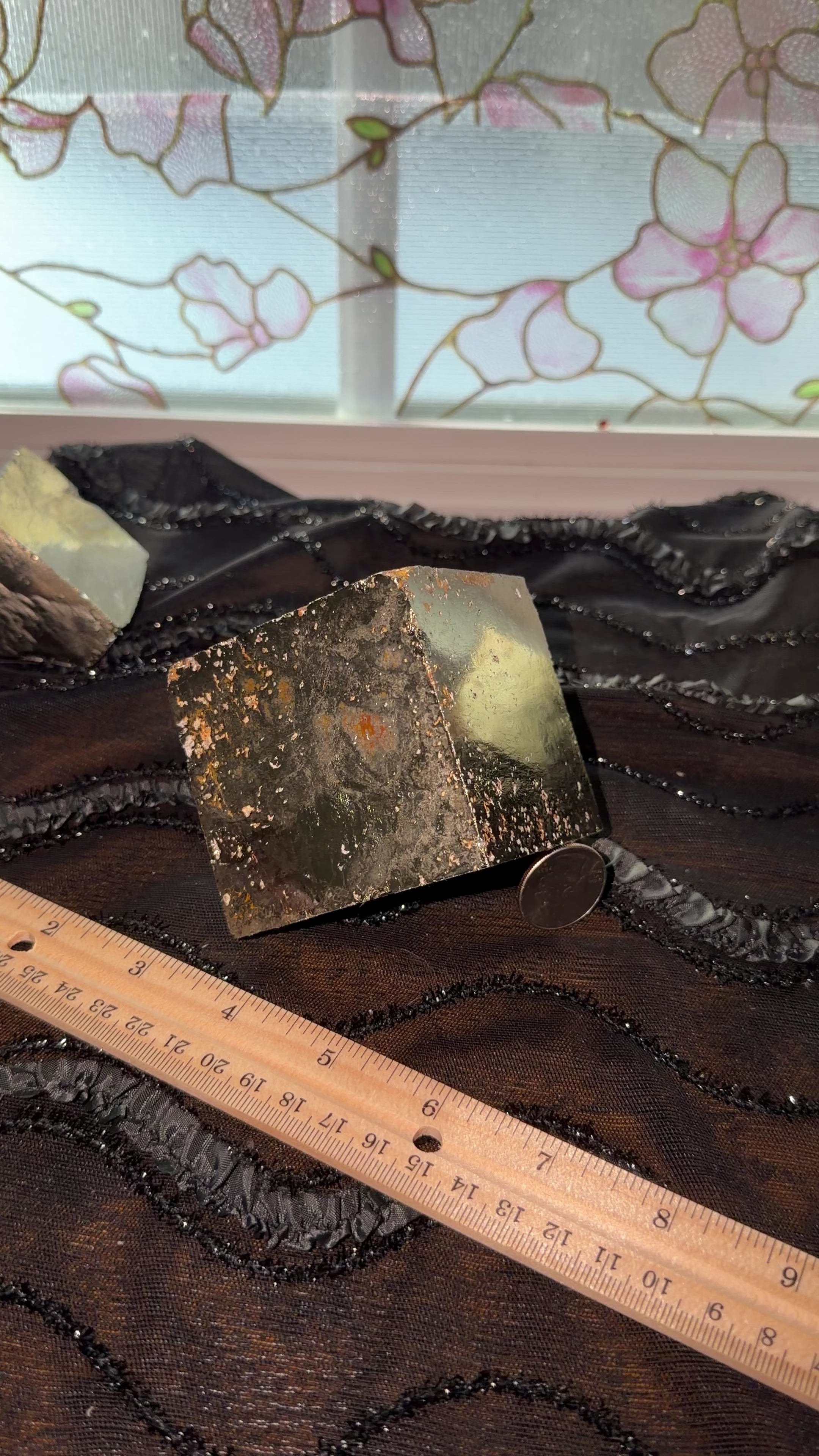 Extra large gold/bronze pyrite cube displayed next to ruler for size reference. Then held in hand and shown a 360 view.