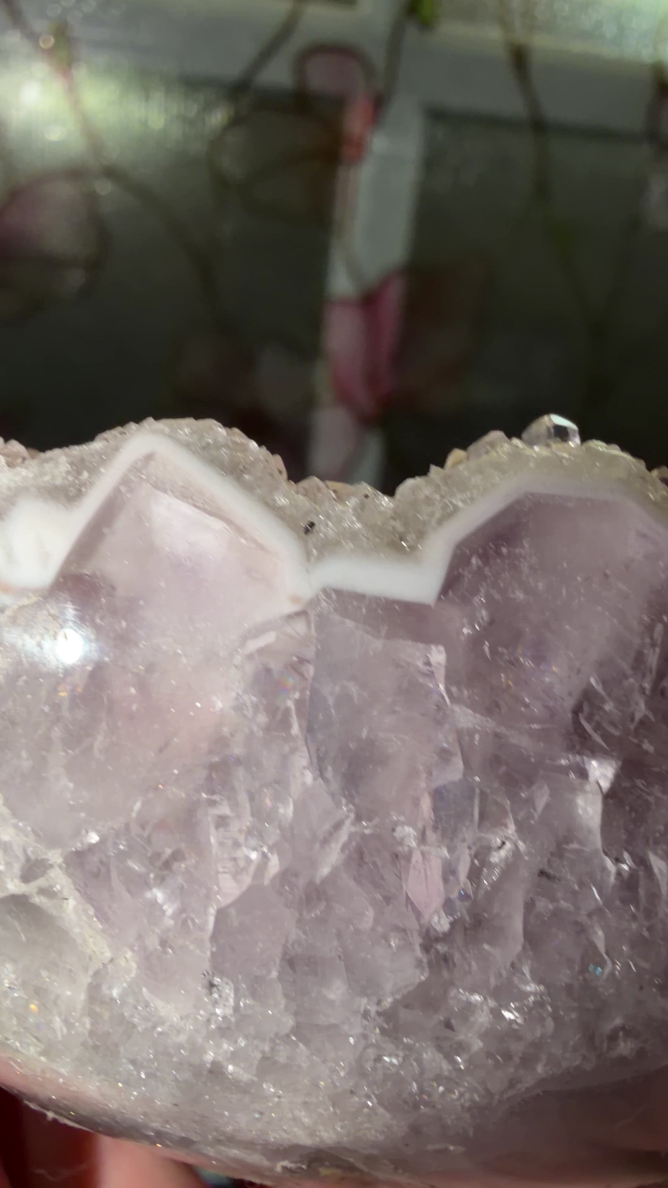 Close up highlighting the white phantom points and rainbow fulled purple amethyst. 