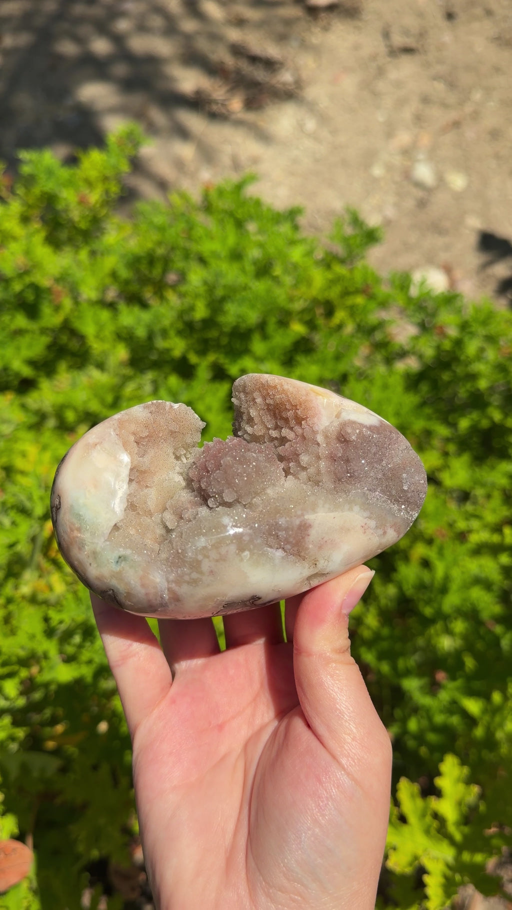 Uruguayan polished freeform. Orange, red, and cream hues. Druzy botryoidal formations. Sideways egg shaped. 