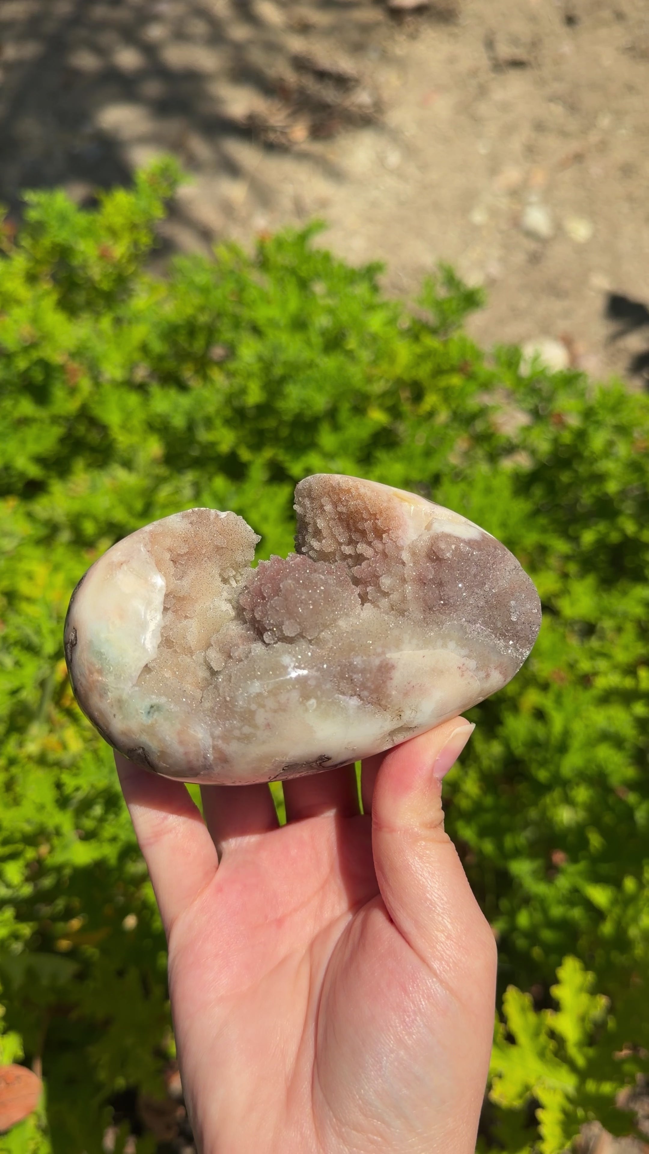 Uruguayan polished freeform. Orange, red, and cream hues. Druzy botryoidal formations. Sideways egg shaped. 