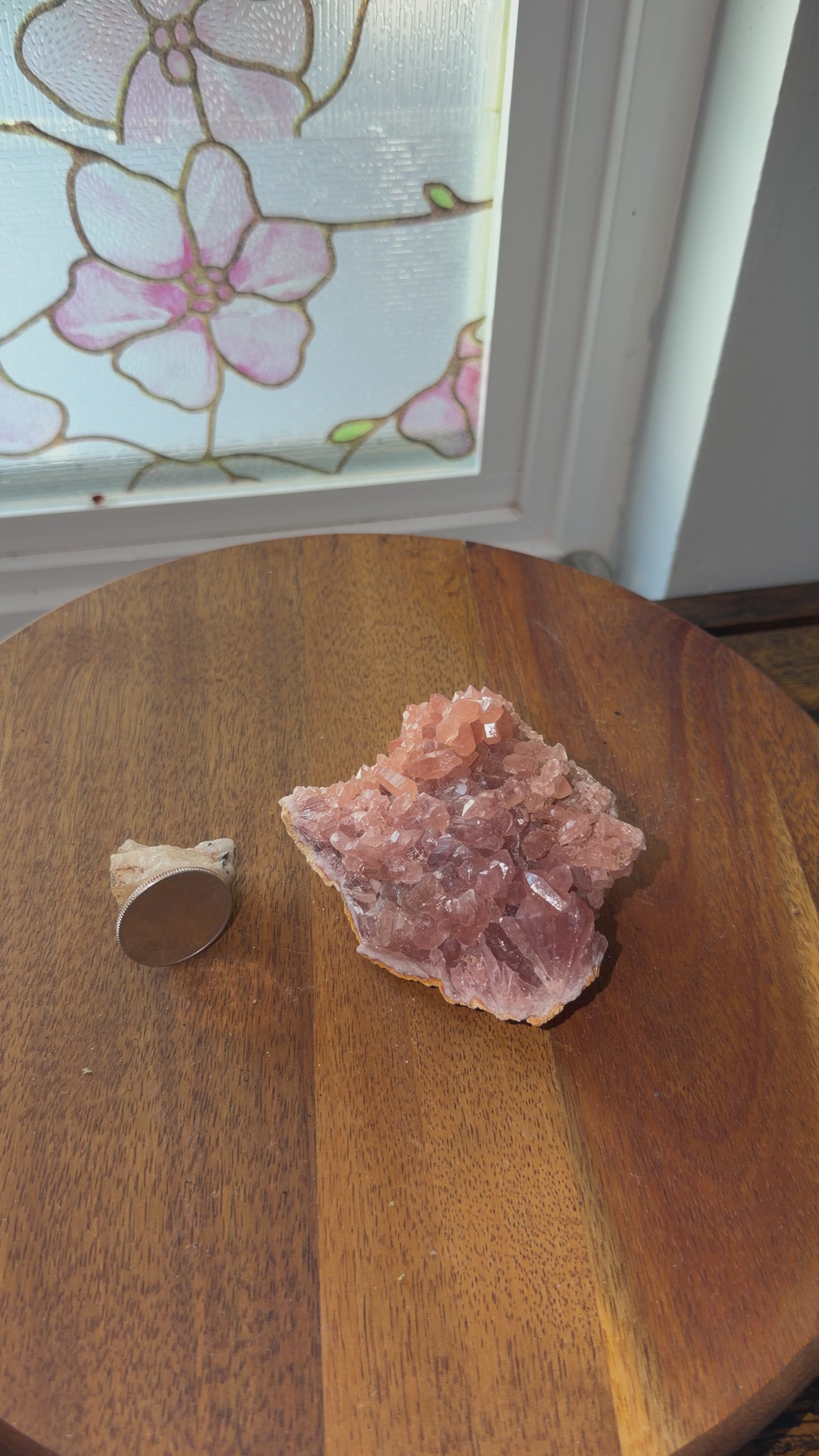 Natural deeply saturated pink amethyst geode shown next to quarter for size reference. Displayed on a spin table and shown a 360 view. 