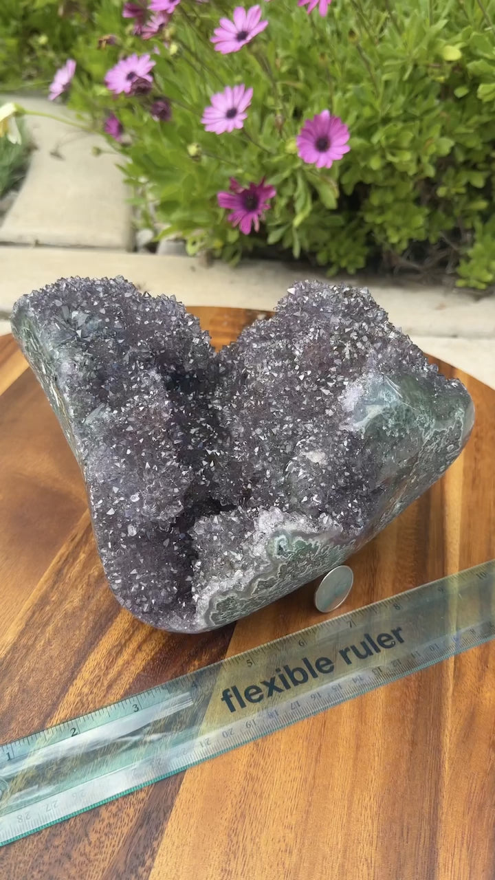 Close up highlighting size, internal caves, and gold geothite inclusions. 