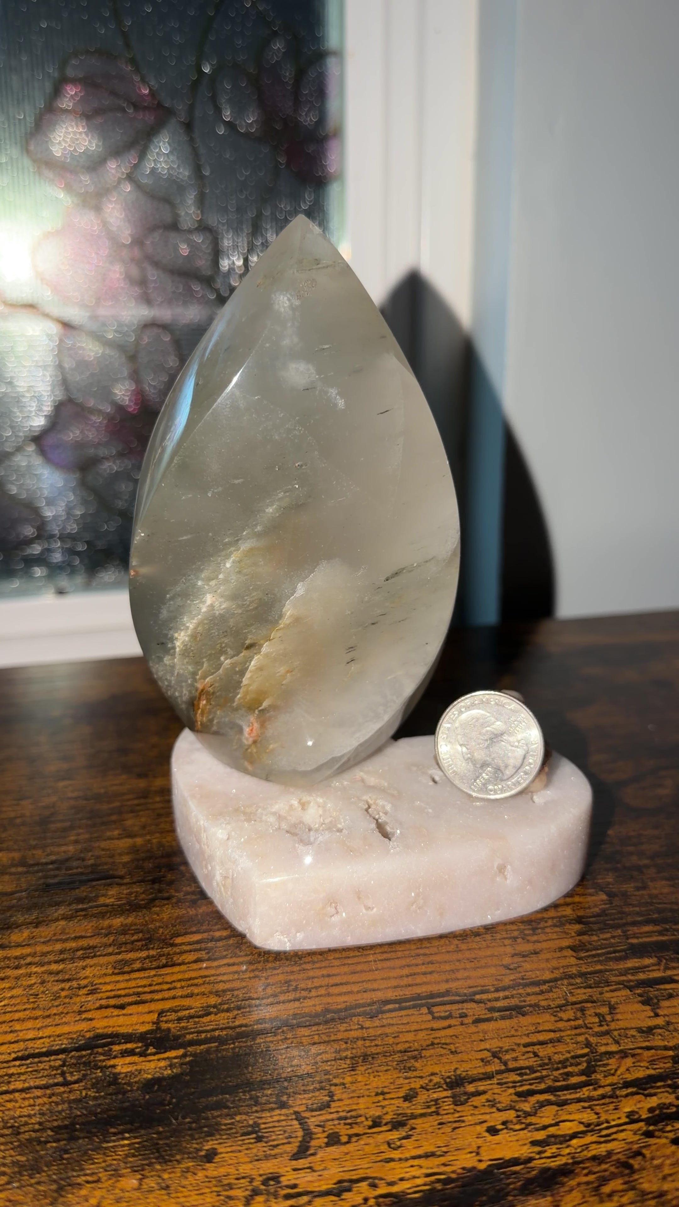 360 view of Smokey garden quartz flame from Brazil. Approx 5 inch tall. Quarter in view for size reference